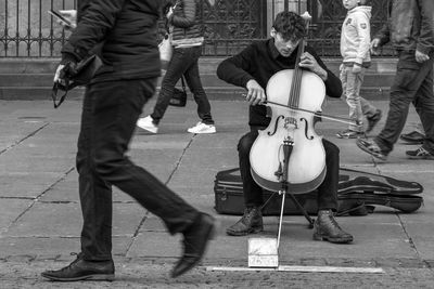 People playing guitar on street