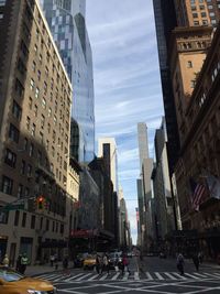 City street against cloudy sky