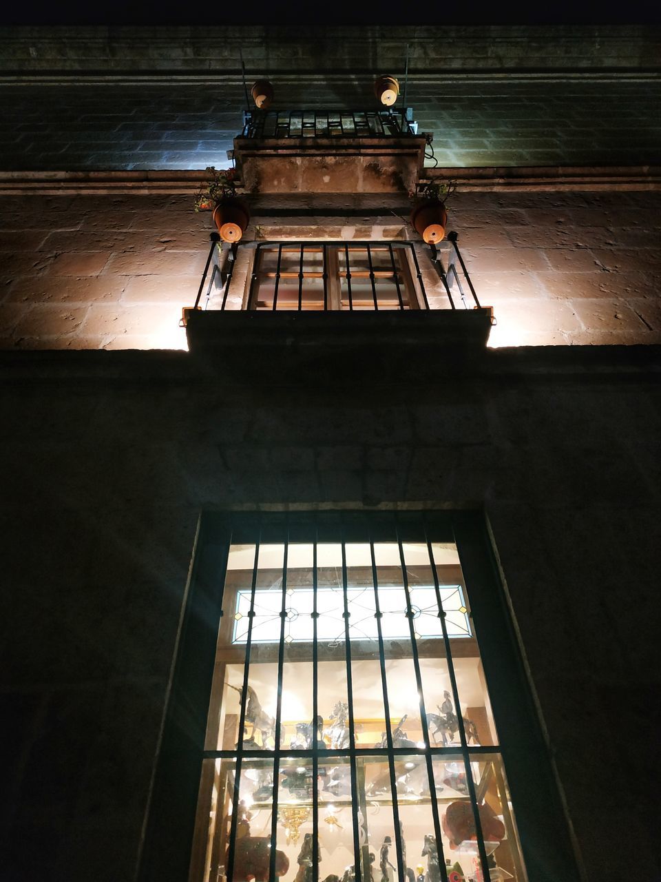 low angle view, window, indoors, architecture, built structure, no people, day, building, glass - material, sunlight, nature, lighting equipment, illuminated, wood - material, ceiling, glass, old, metal, electric lamp