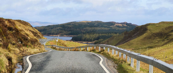 High angle view of road amidst mountains against sky