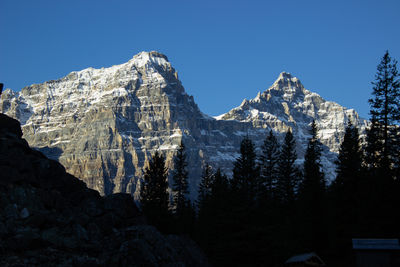 Valley of ten peaks near moraine lake on a sunny autumn day with snow on the mountain.