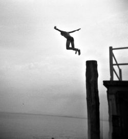 Full length of woman jumping in mid-air