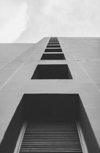 Low angle view of office building against sky