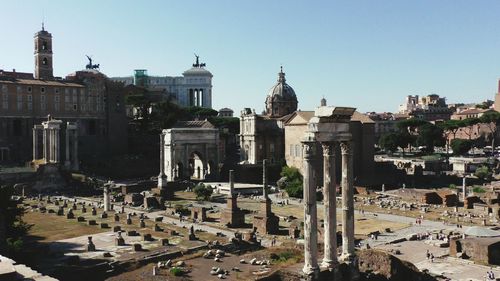 High angle view of old ruins in town against clear sky