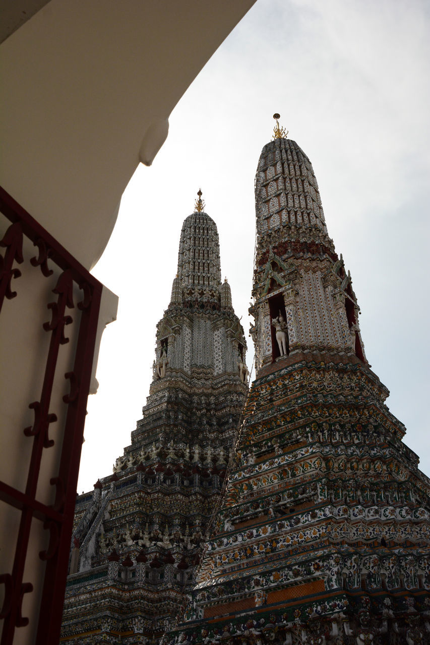 architecture, built structure, travel destinations, building exterior, religion, travel, belief, tourism, building, temple - building, history, the past, temple, spirituality, sky, place of worship, low angle view, city, landmark, dome, nature, no people, tower, outdoors, business finance and industry, ancient