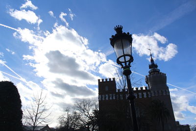 Low angle view of tower against cloudy sky