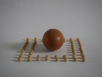 Close-up of eggs on white background