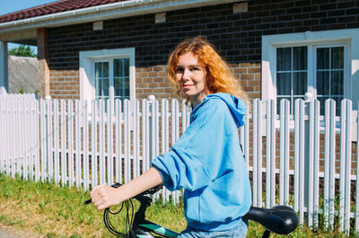 A young woman uses a modern electric bicycle for sports and outdoor recreation