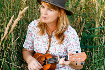 Young woman playing guitar