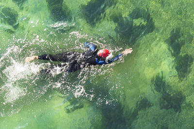 Directly above shot of man swimming in pool