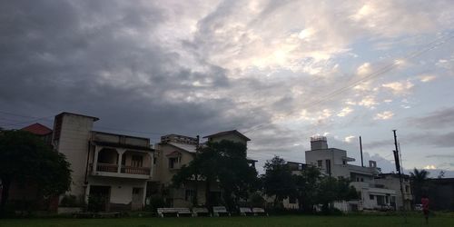 Houses and buildings against sky