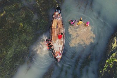 High angle view of people on boat in river