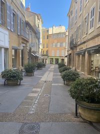 Street amidst buildings against sky