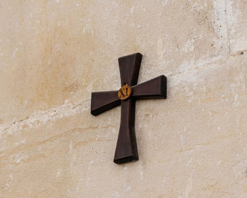 Close-up of cross on wall