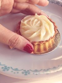 Close-up of hand holding ice cream