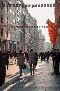 Group of people walking on city street