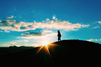 Silhouette of people at sunset