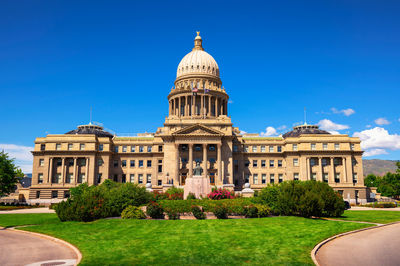 Low angle view of historical building against clear blue sky