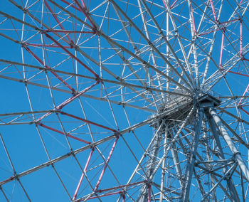 Full frame shot of ferries wheel against clear blue sky