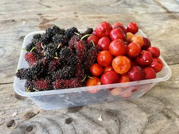 High angle view of strawberries in container on table