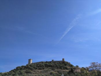 Low angle view of castle against blue sky