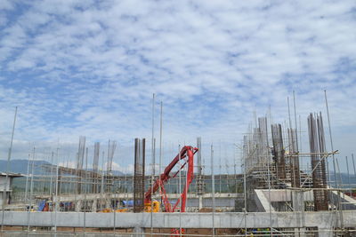 Construction site in city against sky