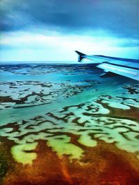 Scenic view of sea against cloudy sky