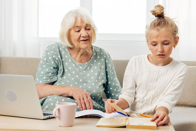 Family using digital tablet at home