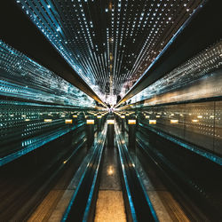 Illuminated bridge at night