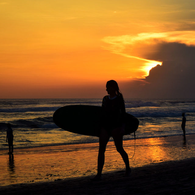 sunset, sea, horizon over water, beach, orange color, water, silhouette, lifestyles, leisure activity, shore, sky, men, sun, scenics, beauty in nature, full length, person, standing, vacations