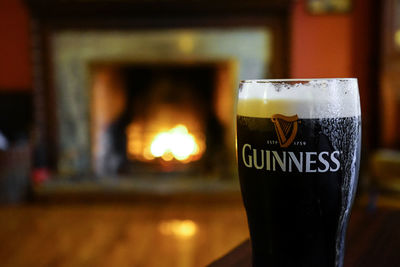 Close-up of beer glass on table