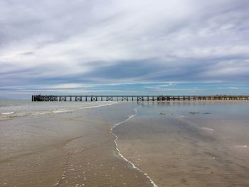 Scenic view of calm sea against blue sky