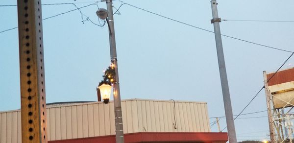 Low angle view of cables against clear sky