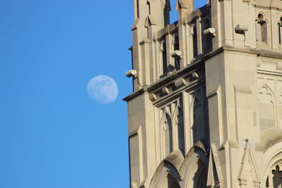 Low angle view of building against blue sky