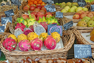 High angle view of fruits in wicker basket at market for sale