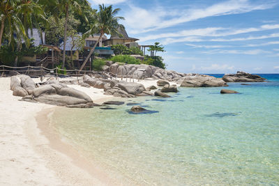 View of rocks on beach against sky