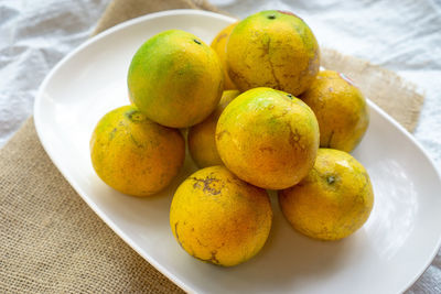 High angle view of fruits in bowl on table