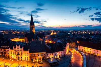 High angle view of illuminated buildings in city