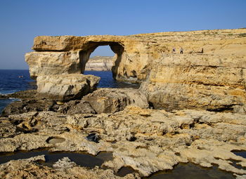 Scenic view of beach against clear sky