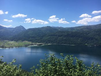 Scenic view of lake and mountains against sky