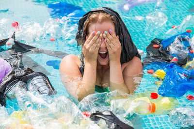 High angle view of woman swimming in pool