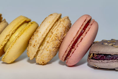 Row of delicious colorful french macaroons of different flavors, background, panoramic shot