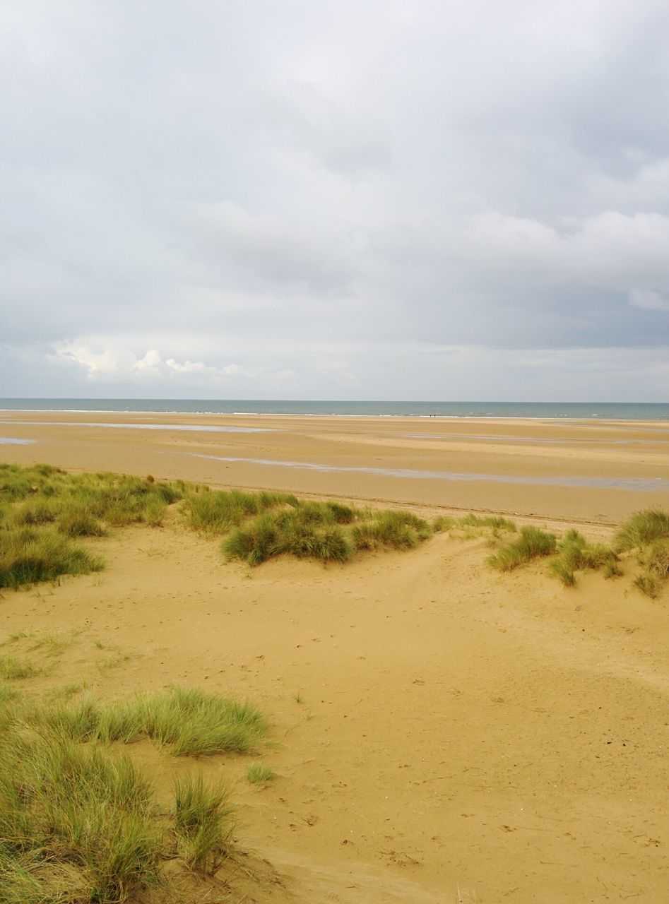 horizon over water, sea, sky, beach, tranquil scene, water, tranquility, scenics, shore, sand, beauty in nature, cloud - sky, grass, nature, cloud, cloudy, idyllic, coastline, remote, non-urban scene