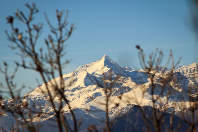 Scenic view of snowcapped mountains against clear sky