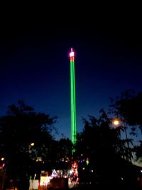 Illuminated lights against clear sky at night