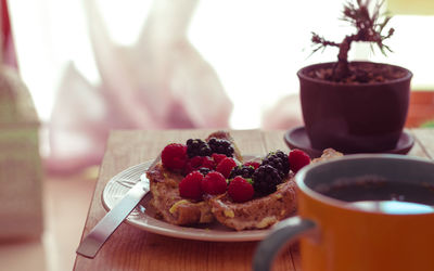 Close-up of fruits in plate on table