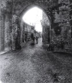 Rear view of people walking on road