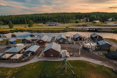 High angle view of houses on field against sky