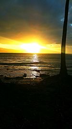 Scenic view of sea at sunset