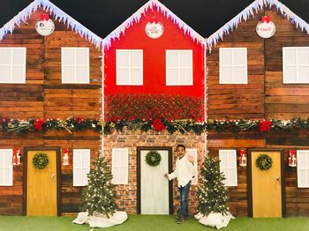 Illuminated christmas tree by building